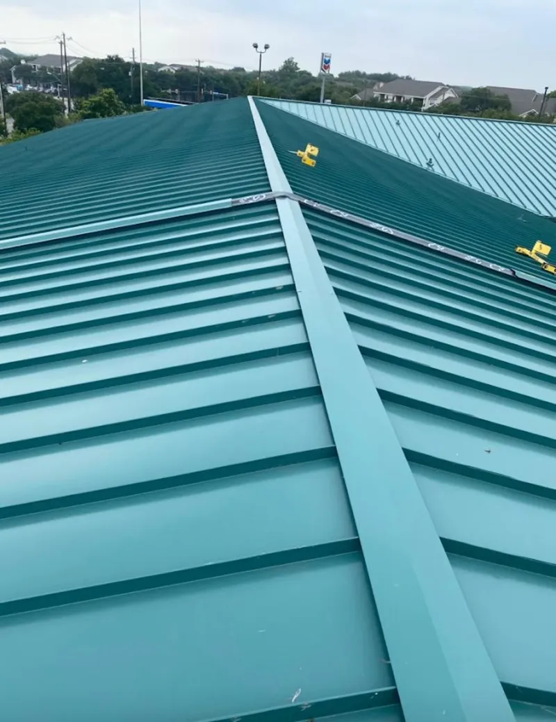Green commercial metal roof ridge and valley for Metal Roof Repair in Westwood Lakes